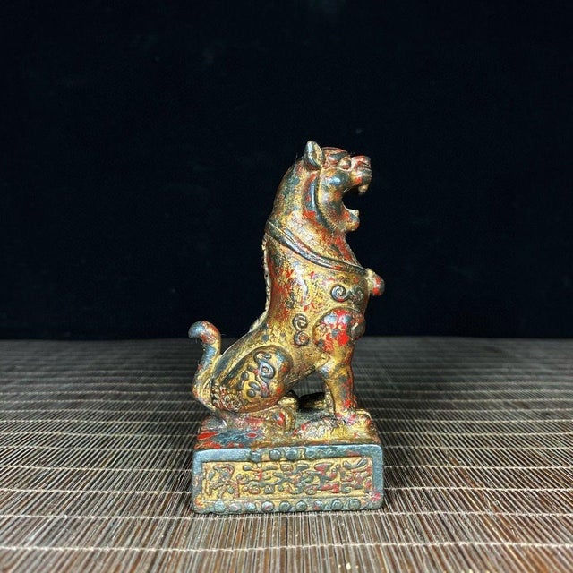 This is a fascinating vintage Chinese bronze seal, cast in the form of a seated tiger on a rectangular base. The tiger is...