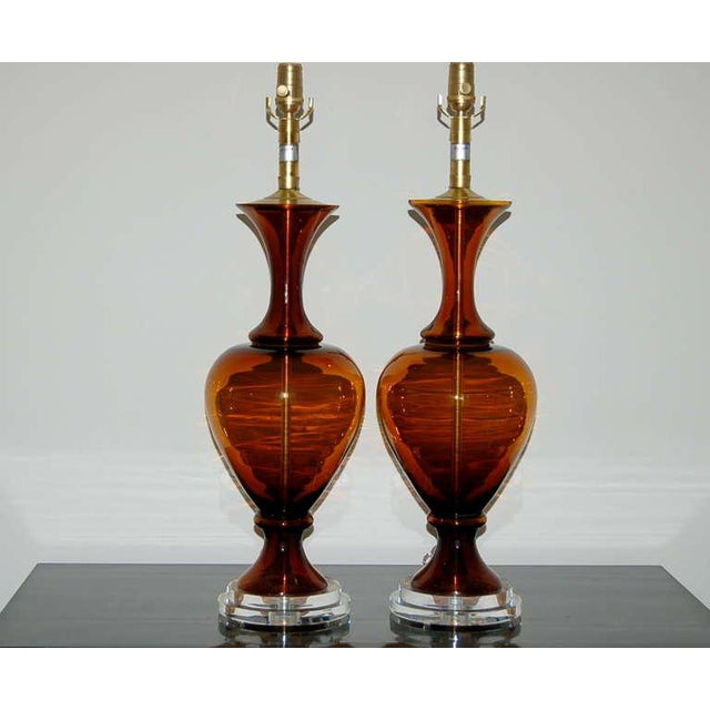 A matched pair of vintage Swedish glass table lamps in ROOT BEER by The Marbro Lamp Company. The three-piece Venetian...