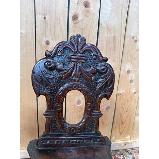 Pair of 18th-century alsatian chairs in dark-stained solid wood, in the german baroque style with louis xiii influences....