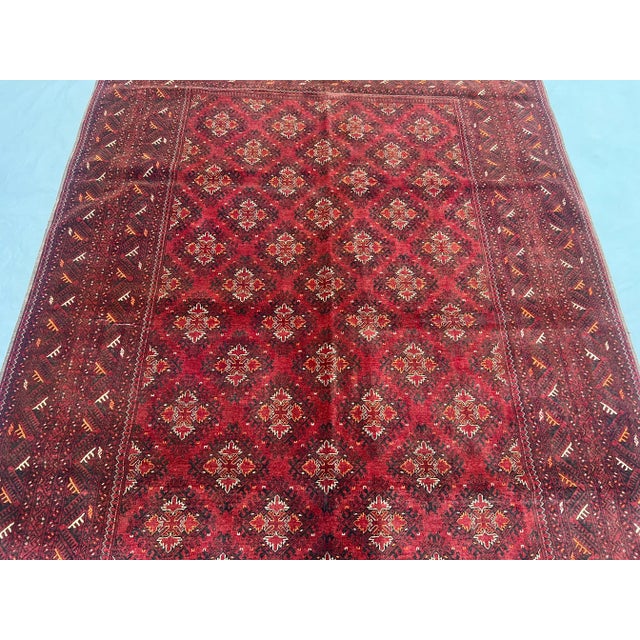 This beautiful vintage Afghan Turkoman Ersari rug showcases a timeless tribal medallion pattern in deep red, brown, and...