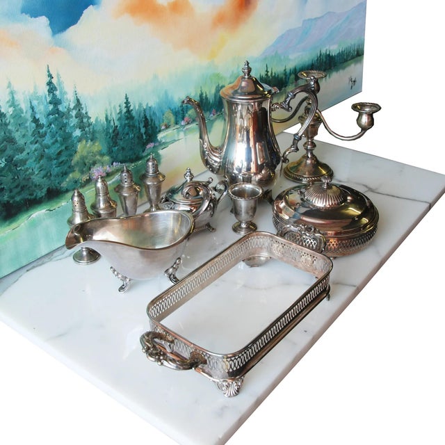This is a set of 11 various sterling silver serving pieces. There are 2 sets of salt and pepper shakers, a gravy boat,...
