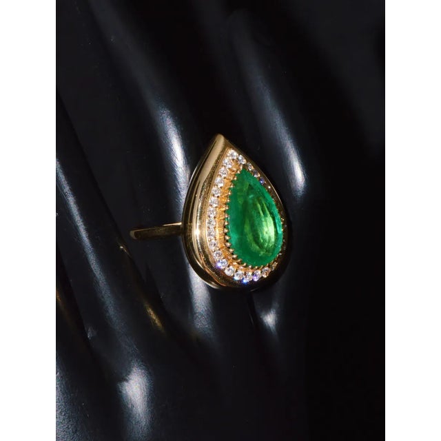 GIA certified 6.46CTS diamond & emerald 18K solid gold halo domed ring. This unique domed halo ring features a large...