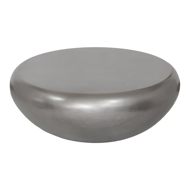 Modern geometry adds up to beautiful entertaining with the Helois faceted coffee table. Crafted of iron with a brass...