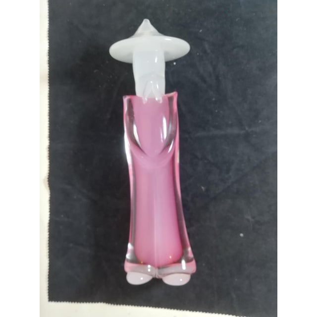 Murano glass figure of a Chinese man with a hat. Produced by the Oball Artistic Glassworks company, which produces glass...