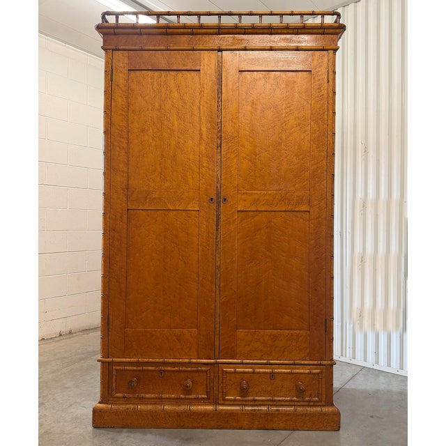This is a fantastic and rare highly decorative French faux bamboo armoire dating to the Belle Époque period, circa...