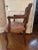Charming petite carved wood arm chair with caning on both front and back. Styled after Louis XV. Suede seat has a few...