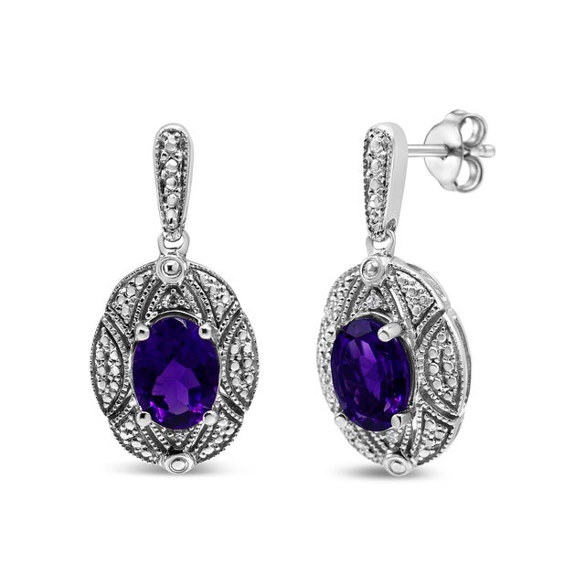 These elegant diamond accent and gemstone stud earrings boast a glorious sense of style! Set in .925 sterling silver, a...