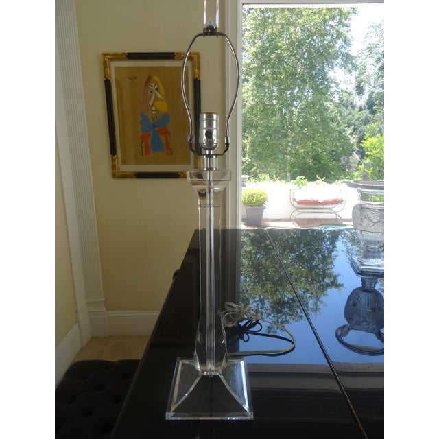 A modern Lucite Lamp Late 20th Century with a matching lucite finial