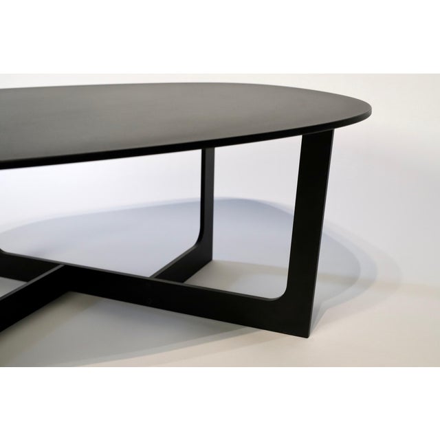 The Cocktail or End Table designed by Ernst & Jensen for Erik Jorgensen is a stunning piece that seamlessly blends form...
