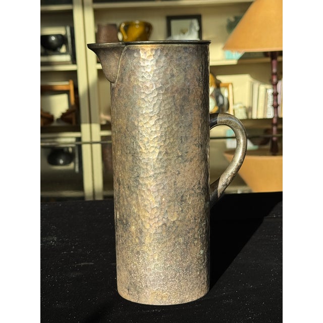 Antique Hand-Hammered Silver-Washed Copper Pitcher, Arts & Crafts, c. 1900–1920 A handsomely formed hand-hammered copper...