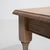 Crafted in France during the 1970s, this distinguished set of three oak nesting tables exemplifies the refined...