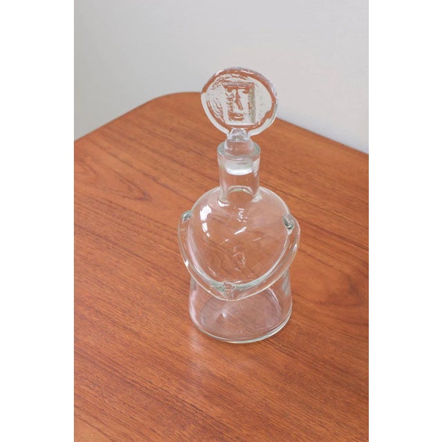 "People" decanter designed by Erik Höglund. produced by Boda during the 1950s. Made from hand blown clear glass. Signed...