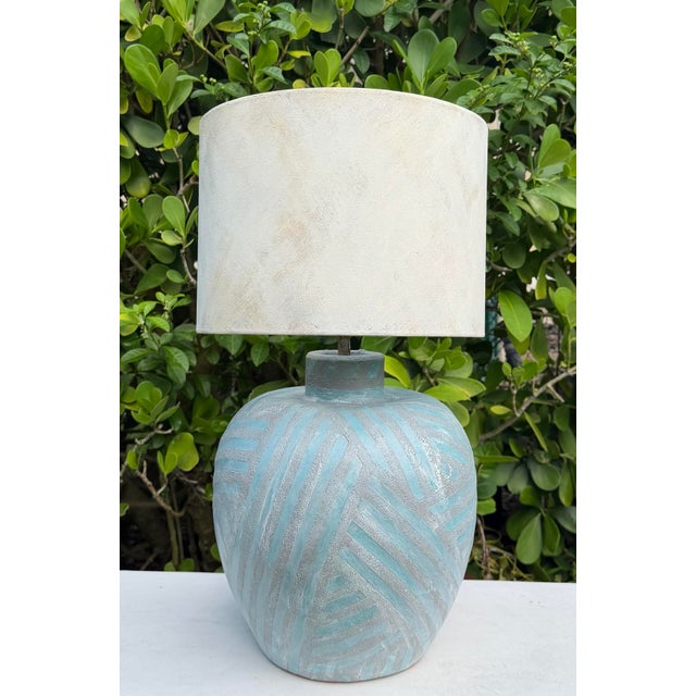 Vintage handcrafted table lamp featuring a heavily textured, hand-painted geometric base in shades of turquoise, blue-...