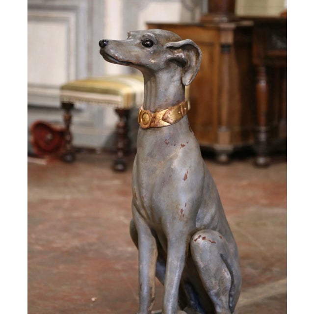 Hand carved near Venice, Italy, circa 1960, this large antique sculpture sits on an integral square red and gilt wooden...