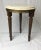 Wonderful little drink stand or plant stand with marble top. 14” in diameter and 18” tall. Dark brass trim above fluted...