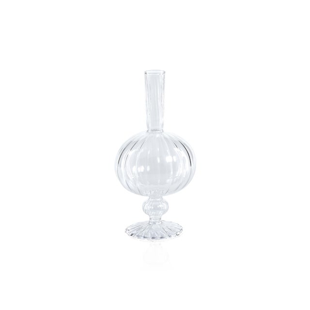 Made of glass, this set of 2 footed vases are a quaint touch to your home. Its exquisite craftsmanship and eye-catching...