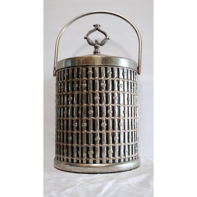 Mid century silver plate bamboo effect ice bucket is a stunner. This beautiful ice bucket came from a great mid century...
