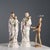 Pair of polychrome biscuit porcelain sculptures with gold details. The sculptures depict the Madonna and Saint Joseph with...