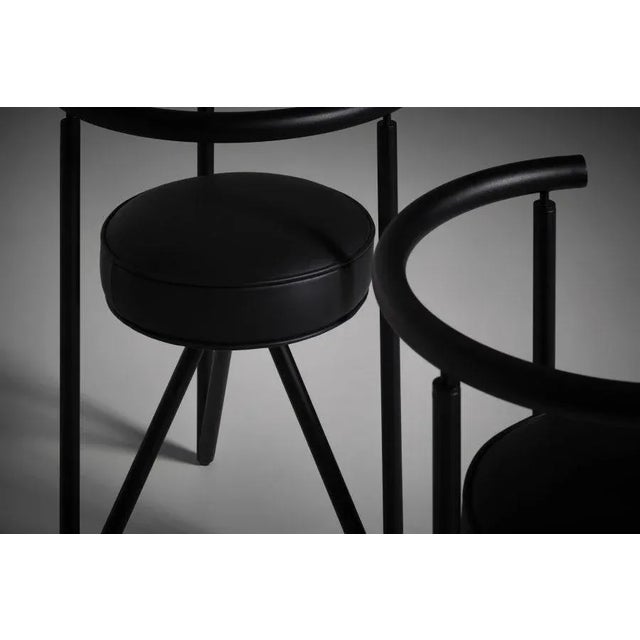 Miss Dorn chairs by Philippe Starck for Disform, 1982. Black coated tubular steel frames and round cylindrical black...
