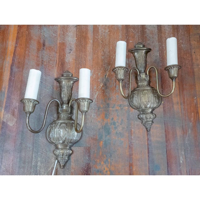 We are selling this nice decorative pair of Georgian or Adams’ revival style sconces. These sconces are made from brass...