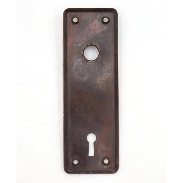 Vintage door back plate made of steel with a japanned finish. The original mounting screws are not available. Good...