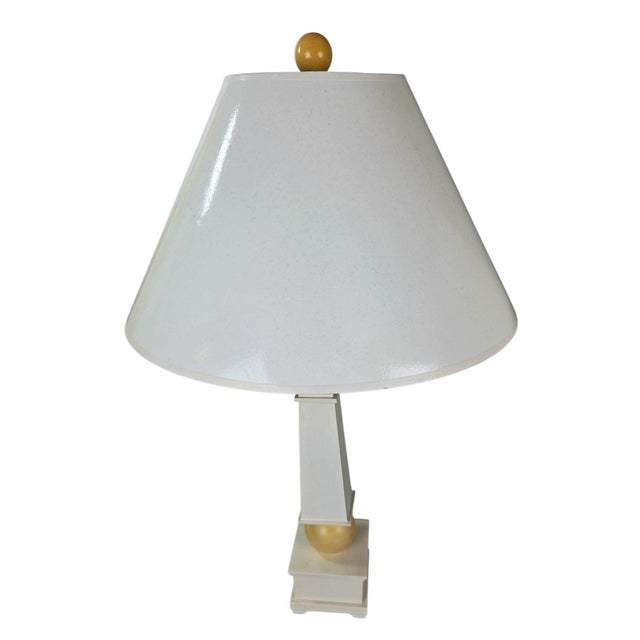 A striking pair of wooden obelisk table lamps by The Natural Light Company of Panama City, Florida. Each lamp is built...