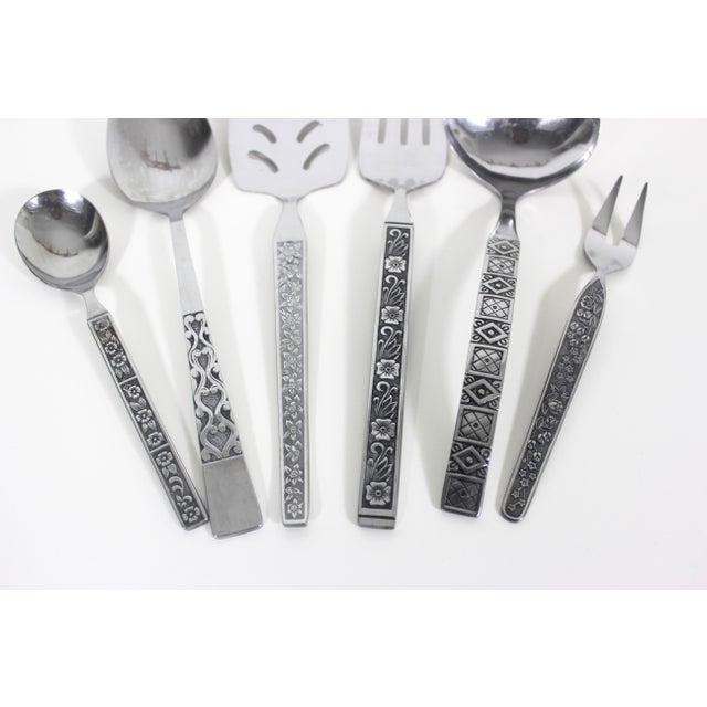 Fabulous set of 6 curated mismatched mid century modern serving pieces in stainless steel with black backgrounds. Great...