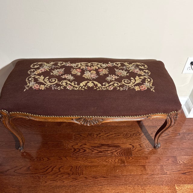 This is a beautiful antique or vintage bench, likely crafted in the French Louis XV style. It features exquisite hand-...