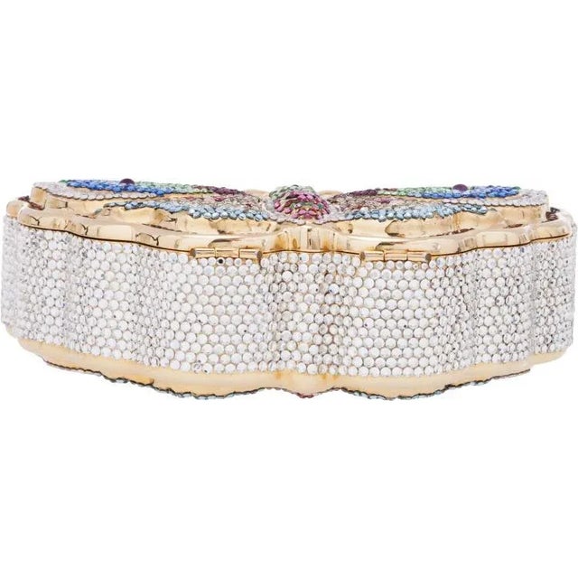 This Judith Leiber evening bag is a favorite among most minaudiere enthusiasts, fashioned in the shape of a butterfly....