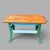 A characterful vintage industrial workbench or utility table combining a thick pine plank top with a substantial cast iron...