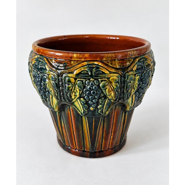 1920s decorative glazed ceramic majolica style Arts & Crafts style jardinière by Brush McCoy, Ohio with raised grape,...