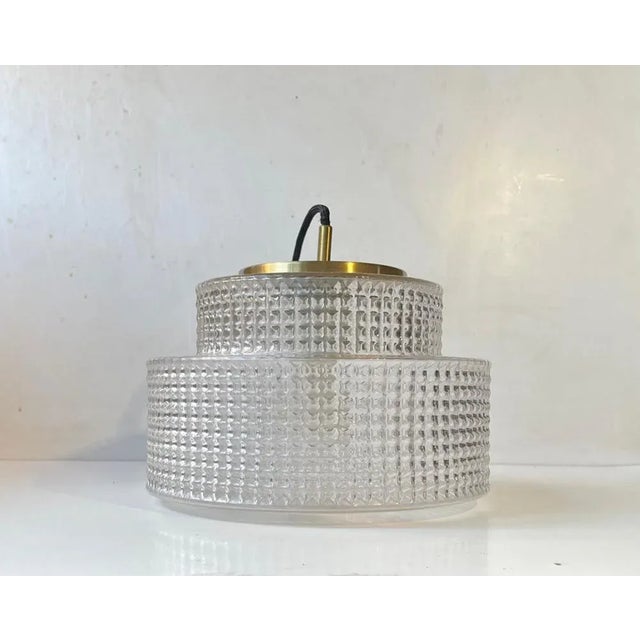 A stylish hanging light designed and manufactured by the Danish design trio Vitrika in the 1960s. The name Vitrika, or Vi-...