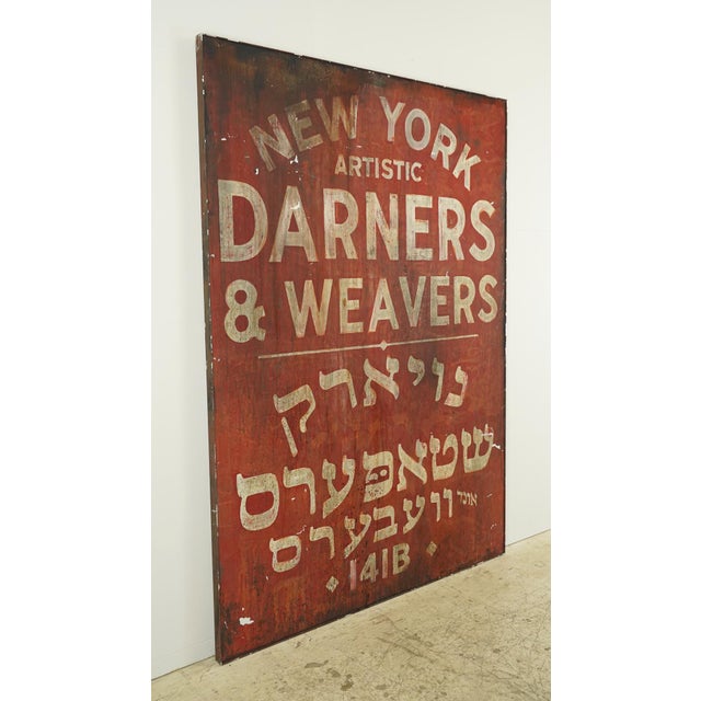Reclaimed movie set sign made of aluminum in red and white. The sign reads "New York Artistic, Darners & Weavers, 141B",...