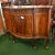 Elegant serpentine sideboard in the Chippendale manner with flame mahogany doors Terminating on Queen Anne legs with ball...