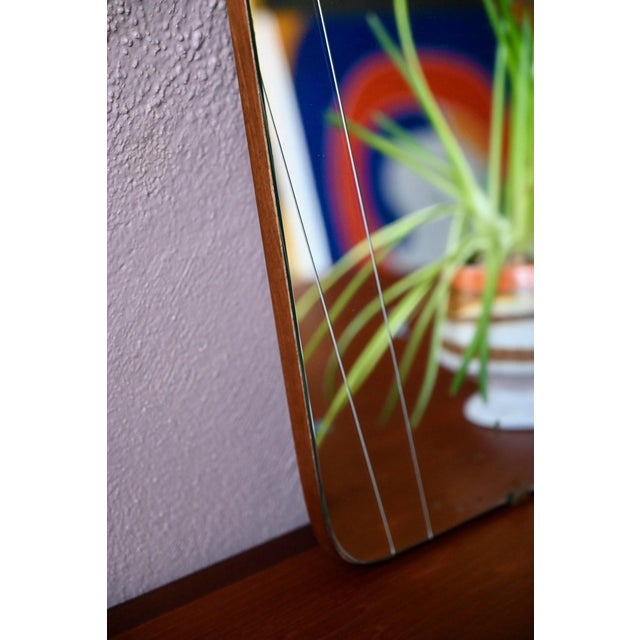 This beautifully crafted "rearview mirror" with its 1950s lines and retro look is truly charming! Its elongated shape and...