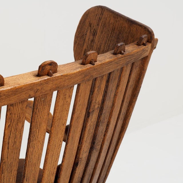 This antique Dutch Arts and Crafts hall bench is a beautiful example of early 20th-century craftsmanship. The bench is...
