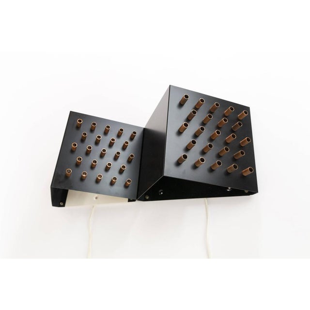 Unique triangular wall lamp (model c 1516) by dutch lighting company raak originating from the 1960s. the name of this...