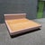A striking postmodern king-size platform bed featuring a sculptural waterfall silhouette and glossy blush pink laminate...