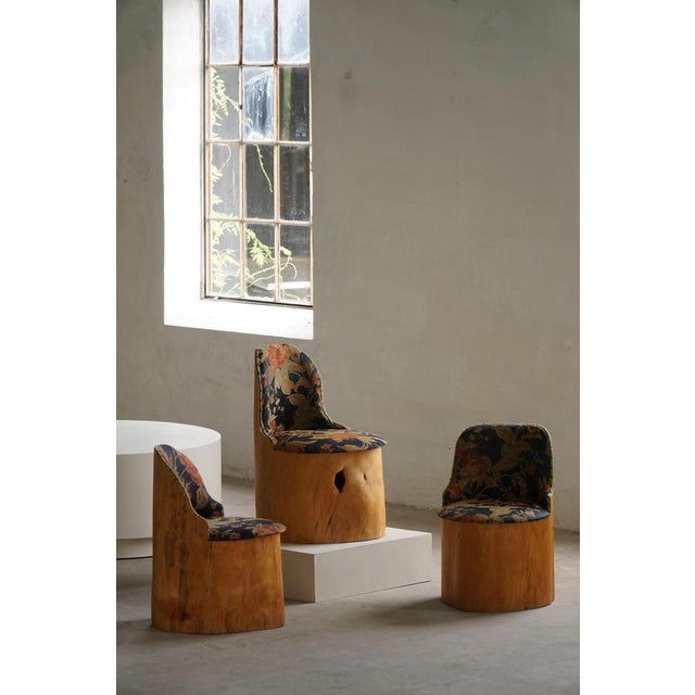 A rare Scandinavian stump chair, known as a "Kubstol", crafted from a solid section of pine trunk and produced in Sweden...