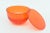 This chic orange round lucite box has a lid that comes off. Great color and great desk accessory. Not sure of its age but...