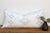Scattered diamond dots drift across this handcrafted Moroccan cactus silk lumbar pillow, drawing the eye toward a central...
