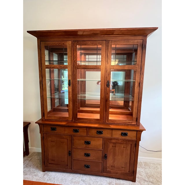 This Broyhill mission style arts and crafts dining room China cabinet has great lines and lots of storage. The shelves are...