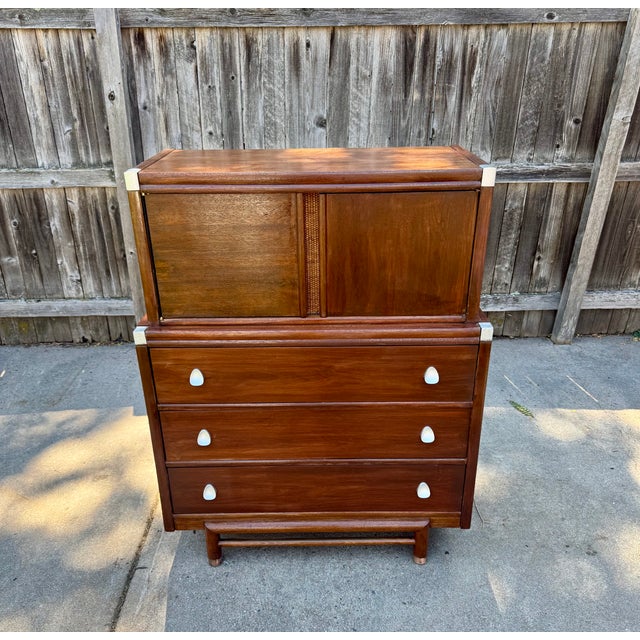 Rare, vintage Modern by Morris of California chest in walnut with cane and silver accents. Upper cabinet with doors over...