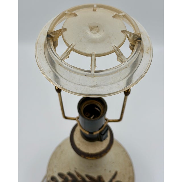 This authentic Danish mid-century table lamp by Axella Keramik features a rustic stoneware base with a beautifully...