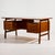 ‘Model 75’ rosewood desk from the 1960s designed by Gunni Omann for Omann Jun Møbelfabrik. The desk has six drawers and...
