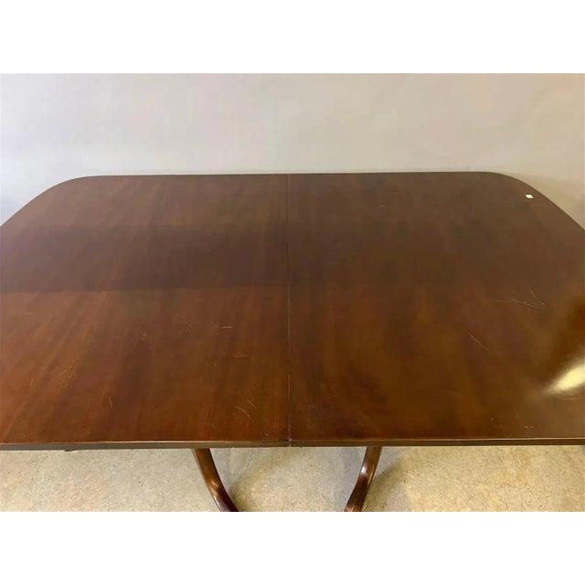 Store Item: Kittinger Solid Mahogany Two Pedestal Dining Table with 3 Leaves Description: Solid Mahogany tabletop no...
