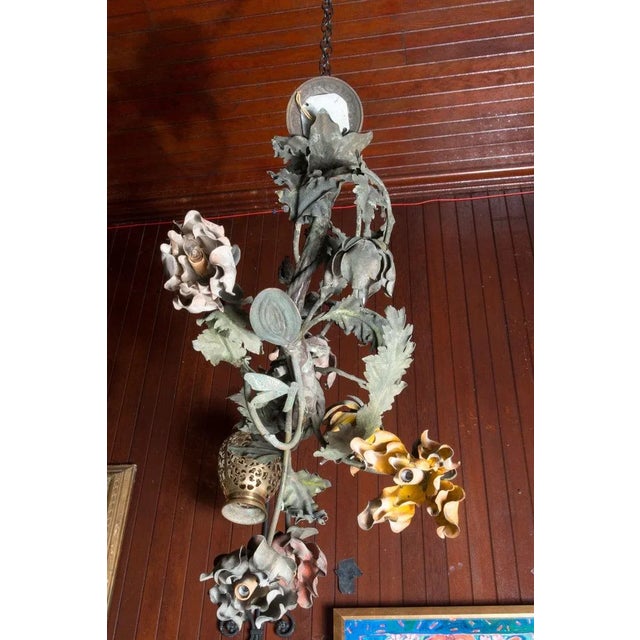 Arts and Craft era wrought iron undulating vine and floral chandelier. Organic natural beauty in the form of a chandelier....