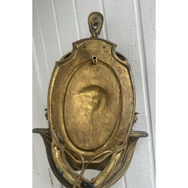 Make a dramatic statement with this exceptional antique French Empire bronze wall sconce, showcasing exquisite...