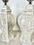 Vintage pair of ceramic Italianate style lamps. Decorative Italian style designs featuring filagree, leaves, columns....