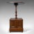 This is an antique purdonium, a til-top table and coal box. An English, Edwardian, walnut side table dating to the early...